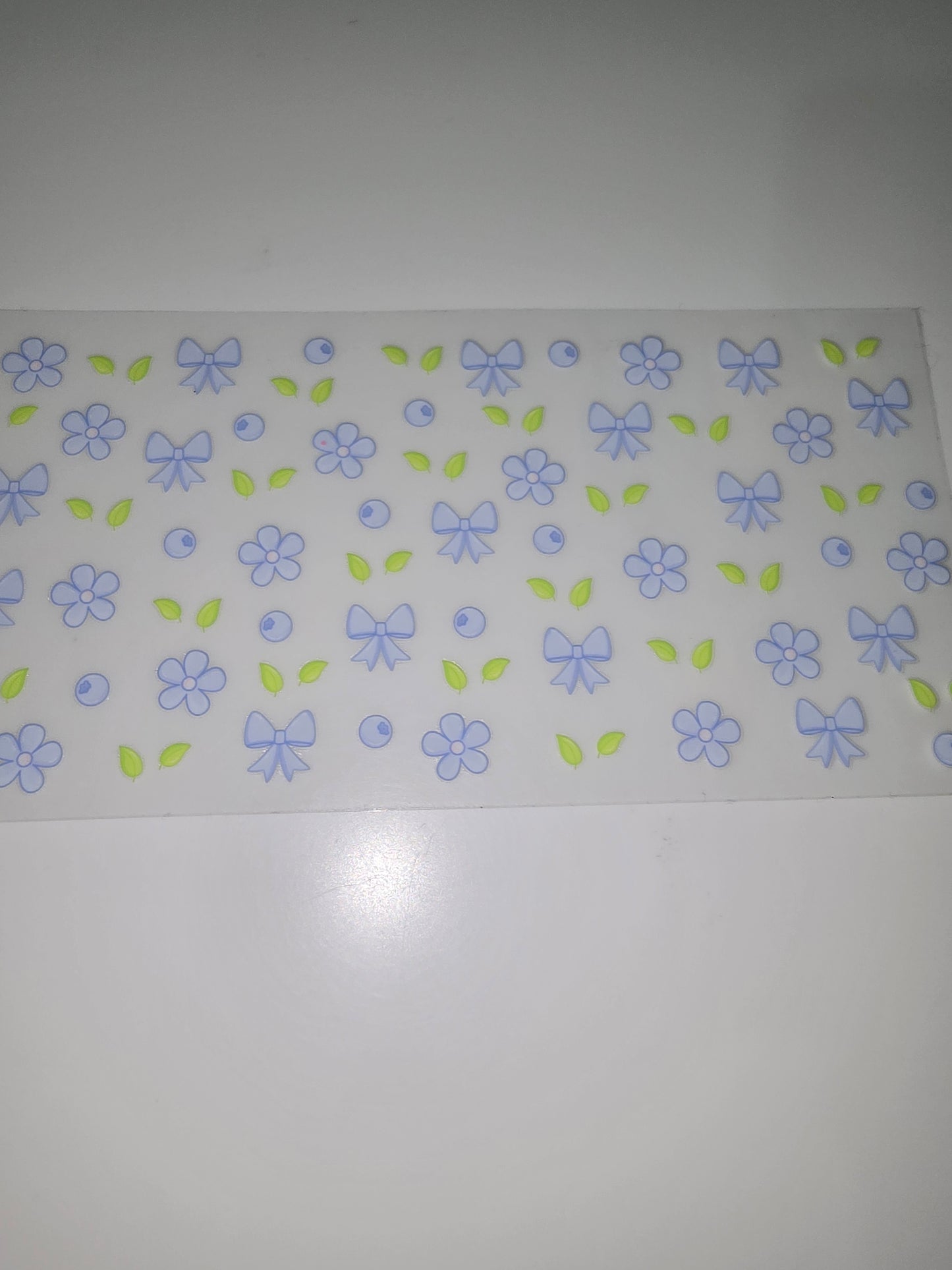 Blue flowers, bows, berries