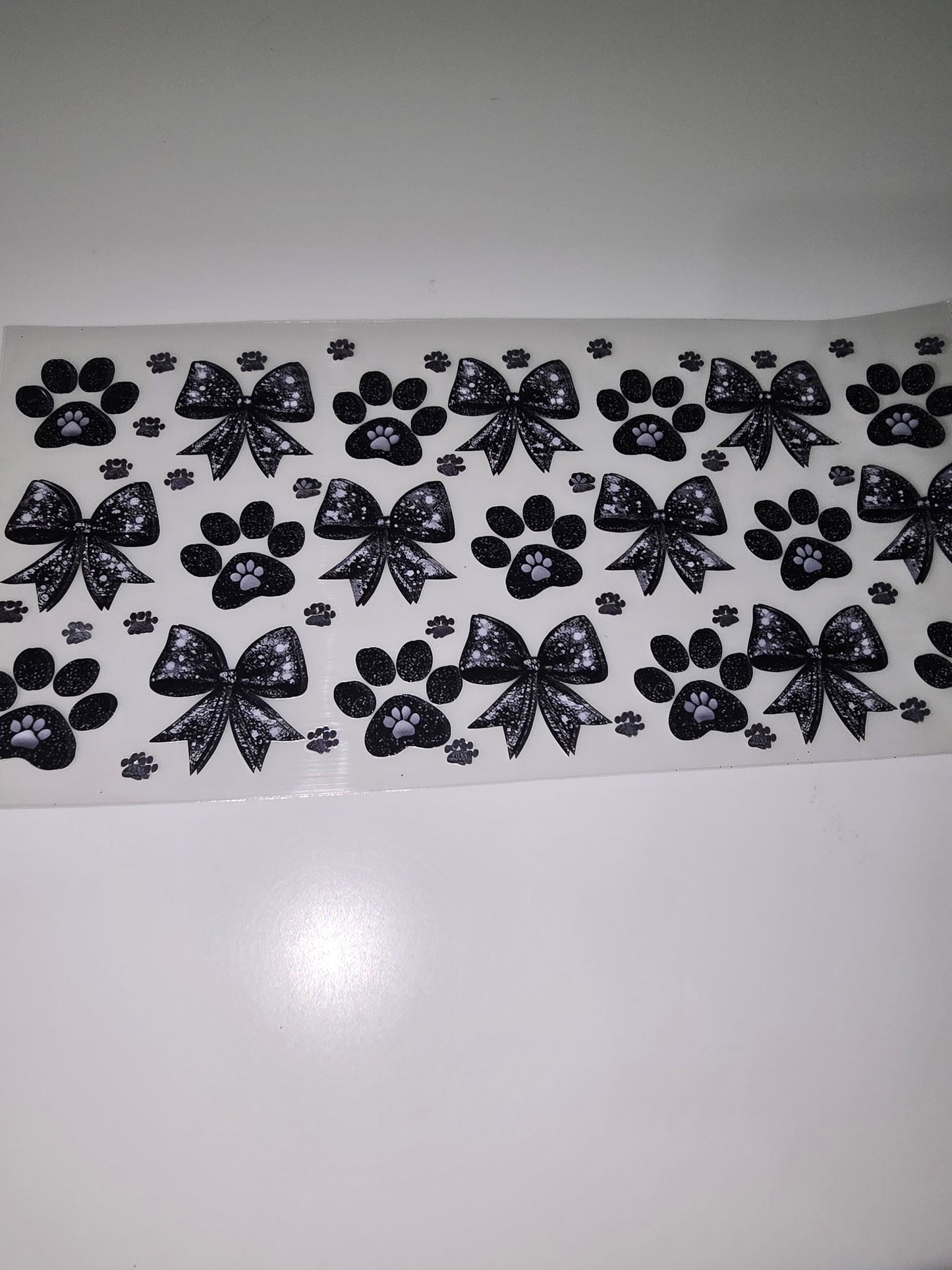 Black bows and paw prints