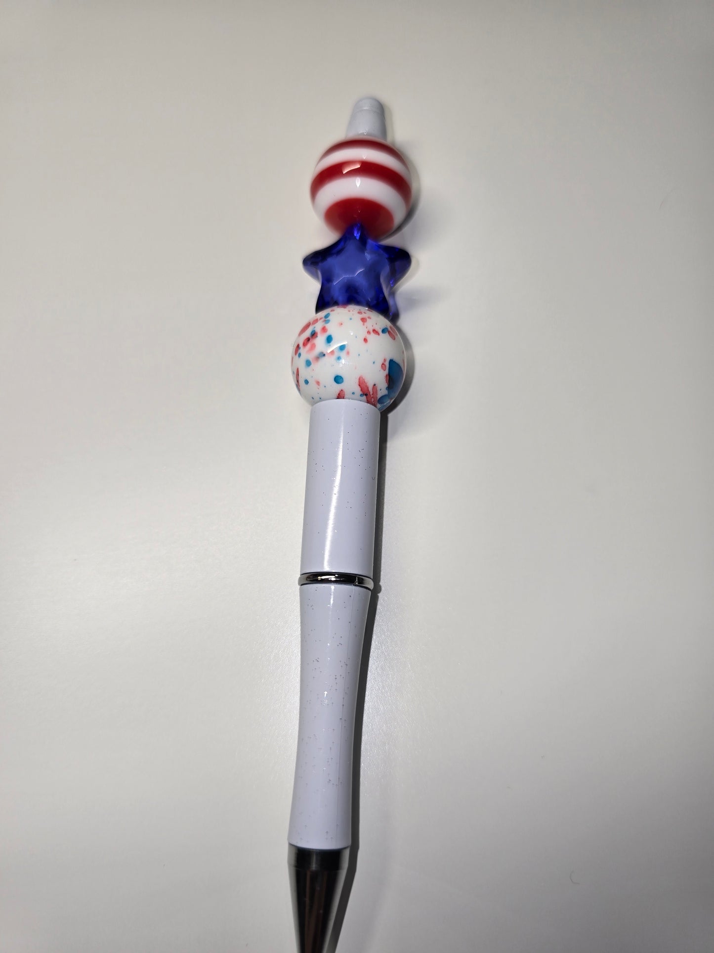 Red stripes, blue star pen