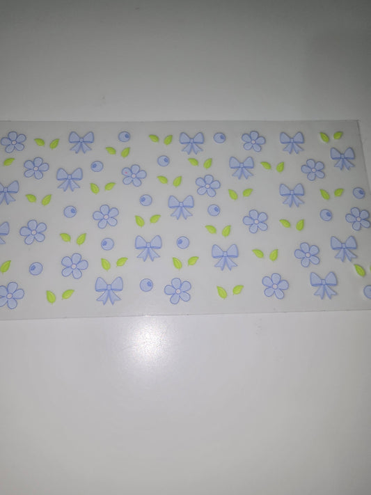 Blue flowers, bows, berries