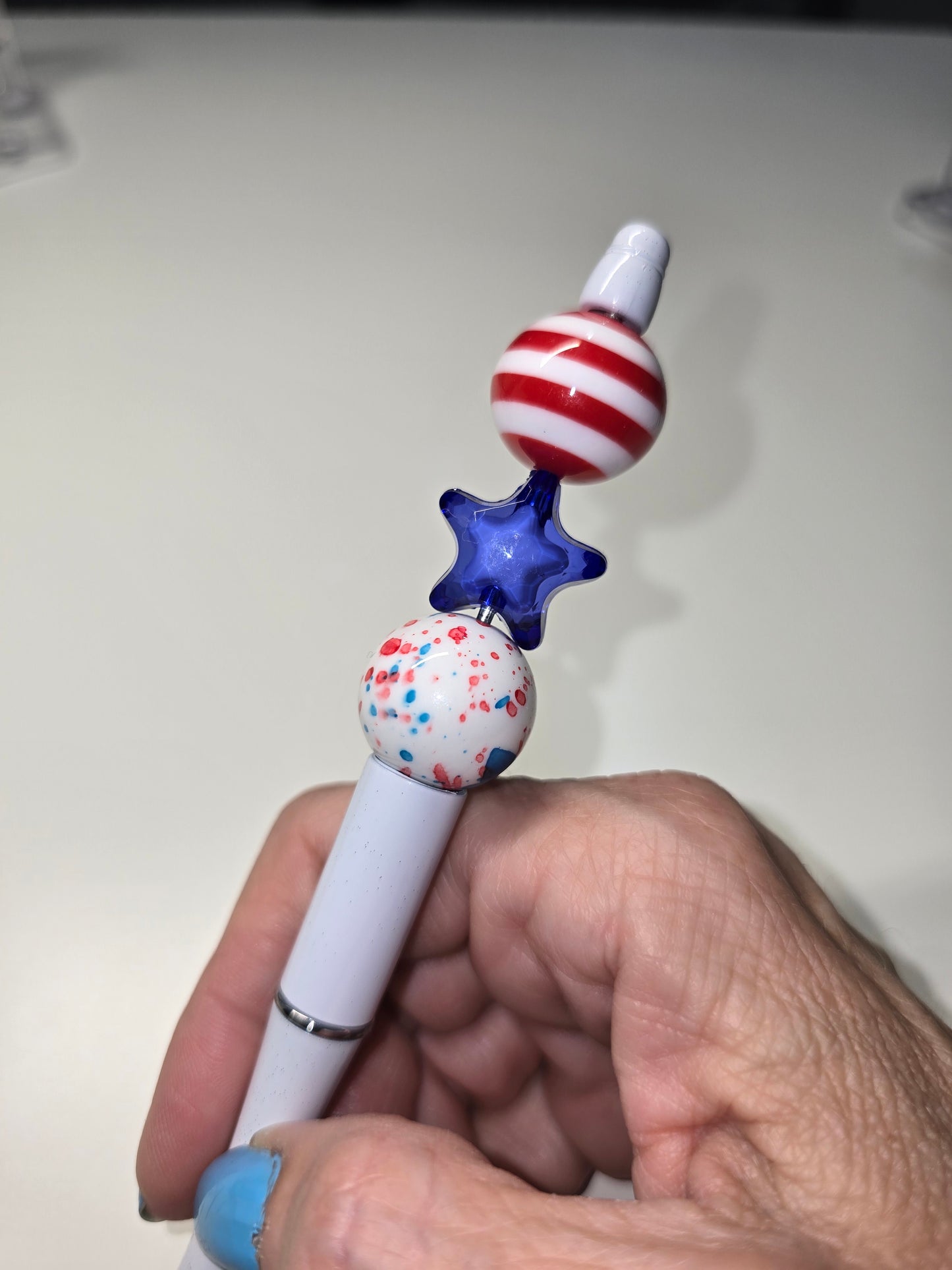 Red stripes, blue star pen